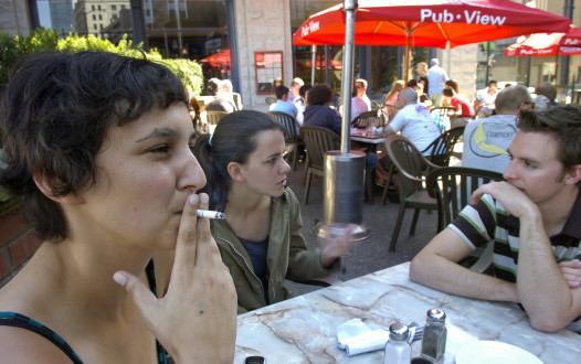 Vancouver, BC - 0911207 -  Vancouver is planning to ban cigarette smoking on outdoor spaces, including restaurant patios. Spanish film-student Violetta Salama lights up, "like they do back home" on the patio of Steamworks in  Gastown.          Peter Battistoni/Vancouver Sun [PNG Merlin Archive]
