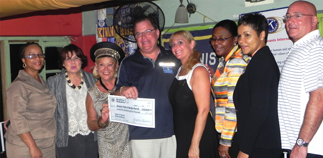 Sponsors from Jewel Resorts Jamaica and The Urban Development Corporation (UDC) as well as Eva Myers, past president of the Kiwanis Club (KC) of the Garden Parish; Lieutenant Governor of Kiwanis Club Bighton (NY), Jordan Neuringer, and his wife Jamie Neuringer, show off their cheque as it was officially handed over to the KC of the Garden Parish at Evita's, Ocho Rios.