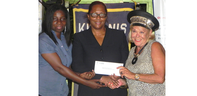 The KC Garden Parish past president Eva Myers, was elated as she handed over the cheque to the current president, C. Angela Strudwick, and president designate, Audrey Sutherland-Grant.