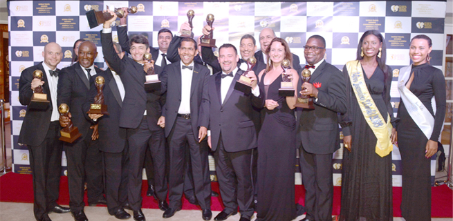 HM World Travel Awards a: Minister of Tourism, Edmund Bartlett (2ND right) is captured in a celebratory mood with (from left) director of tourism, Paul Pennicook; permanent secretary in the Ministry of Tourism, Jennifer Griffith and chairman of the Jamaica Tourist Board (JTB), John Lynch. Mr Bartlett was recognized as the “Caribbean’s Leading Personality for Outstanding Services to Tourism” at the 23rd annual World Travel Awards for the Caribbean & North America, held at Sandals Ochi Beach Resort on Saturday night, September 17, 2016.